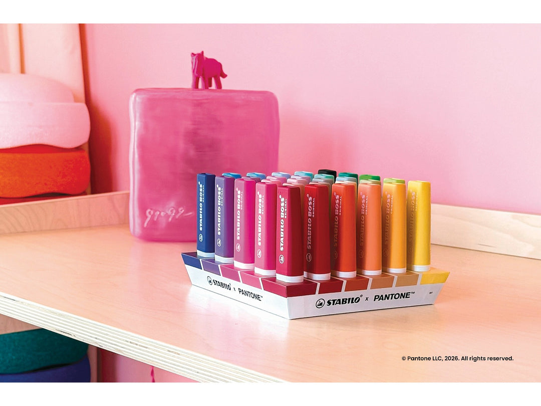STABILO BOSS ORIGINAL x PANTONE desk set of 30 highlighters displayed upright in a colourful pink interior, showing an assorted spectrum of highlighter colours