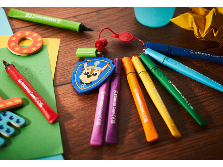STABILO Cappi PAW Patrol felt-tip pens in assorted colours attached to the red cap ring with Chase police badge, displayed on a wooden craft table