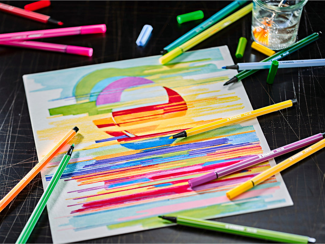 STABILO Pen 68 felt-tip pens arranged around a colourful abstract drawing, showcasing bright assorted colours for sketching, colouring and creative artwork
