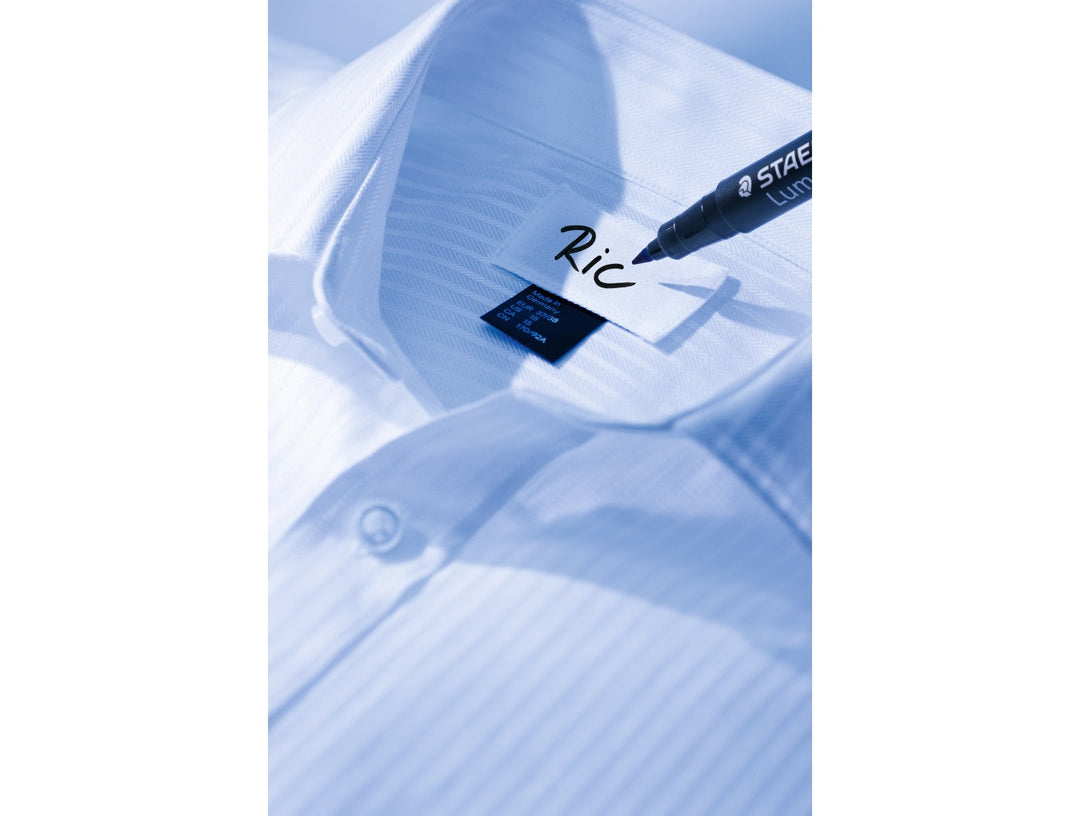 STAEDTLER Lumocolor laundry marker writing on clothing label for permanent fabric marking