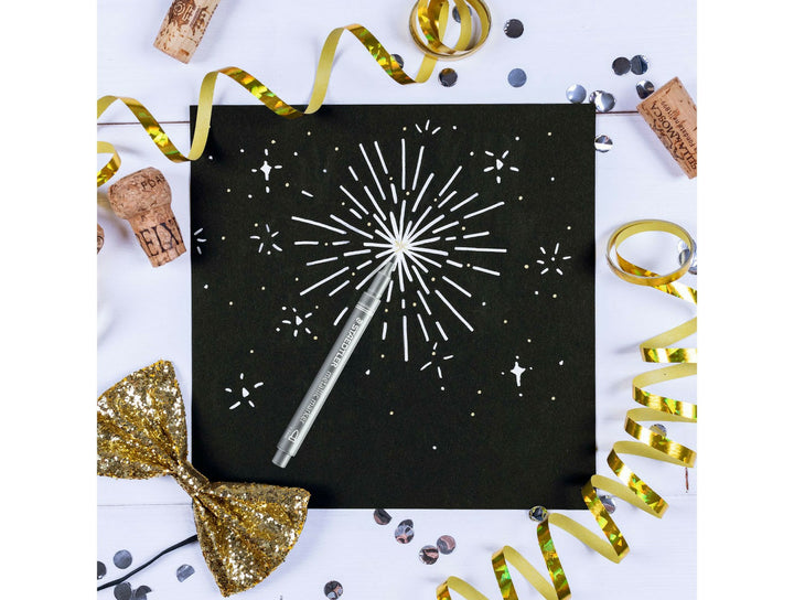 STAEDTLER Metallic Marker 8323 silver pen used on black paper showing opaque metallic ink for decorative designs