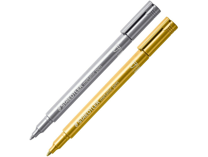 STAEDTLER Metallic Marker 8323 gold and silver pens displayed diagonally with 1–2 mm tips for decorative writing