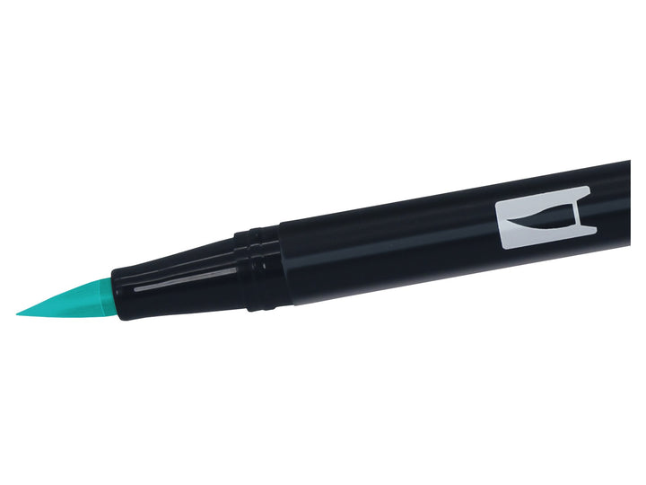 Close-up of the flexible brush tip on a Tombow ABT Dual Brush Pen in Bright Blue (403), designed for creating variable line widths, hand lettering, illustration, colouring, journaling and watercolour-style effects.