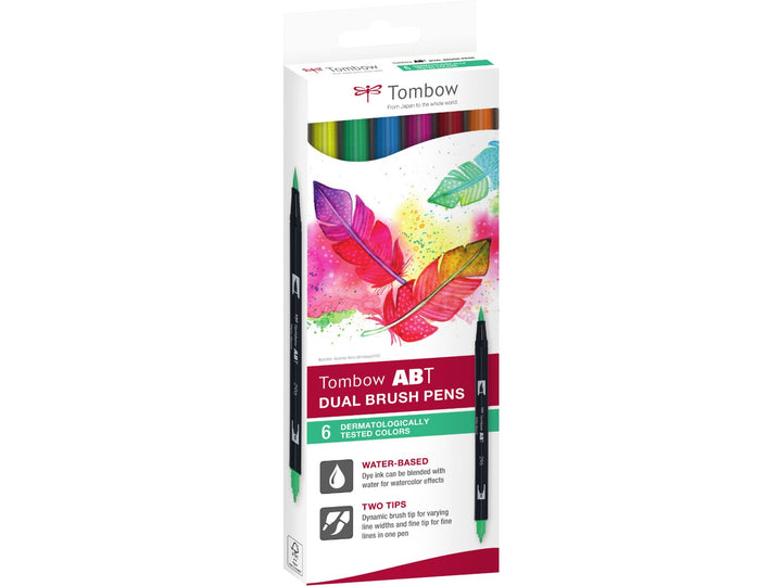 Tombow ABT Dual Brush Pen Dermatologically Tested Colours Set of 6 in original retail packaging, featuring Process Yellow (055), Green (296), Reflex Blue (493), Rhodamine Red (725), Poppy Red (856) and Scarlet (925), with dual brush and fine tips for hand lettering, colouring, journaling, illustration and creative projects.