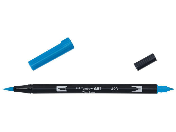 Tombow ABT Dual Brush Pen in Reflex Blue (493) displayed with both caps removed, showing the flexible brush tip and fine bullet tip for hand lettering, illustration, colouring, journaling and watercolour-style effects.