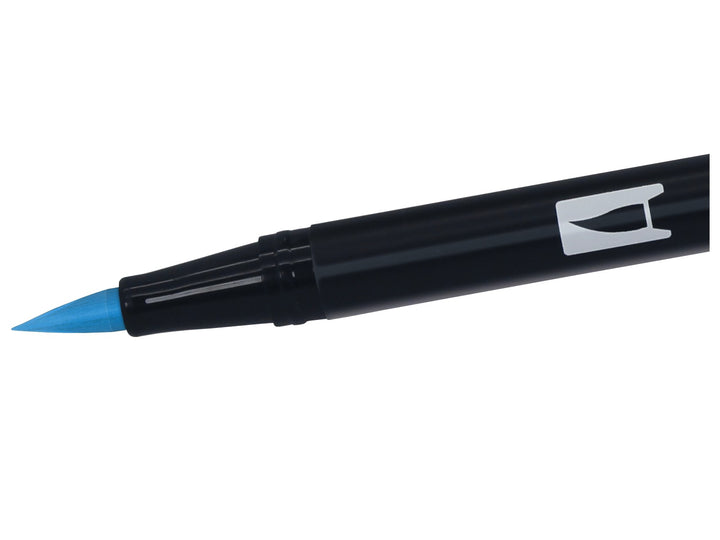 Close-up of the flexible brush tip on a Tombow ABT Dual Brush Pen in Reflex Blue (493), designed for creating variable line widths, hand lettering, illustration, colouring, journaling and watercolour-style effects.