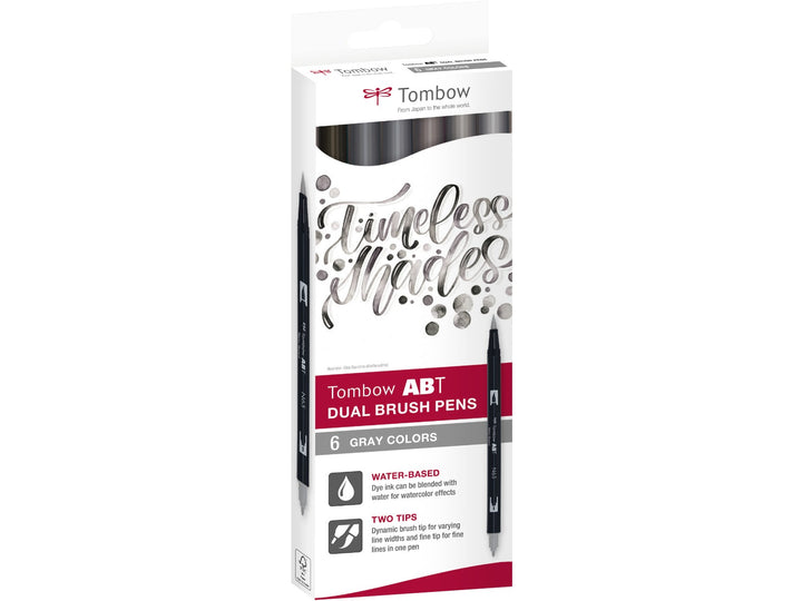 Tombow ABT Dual Brush Pen Grey Colours Set of 6 in original retail packaging, featuring Warm Grey 8 (N49), Cool Grey 5 (N65), Cool Grey 3 (N75), Warm Grey 2 (N79), Warm Grey 1 (N89) and Cool Grey 8 (N95), with dual brush and fine tips for sketching, shading, hand lettering, illustration and monochrome artwork.