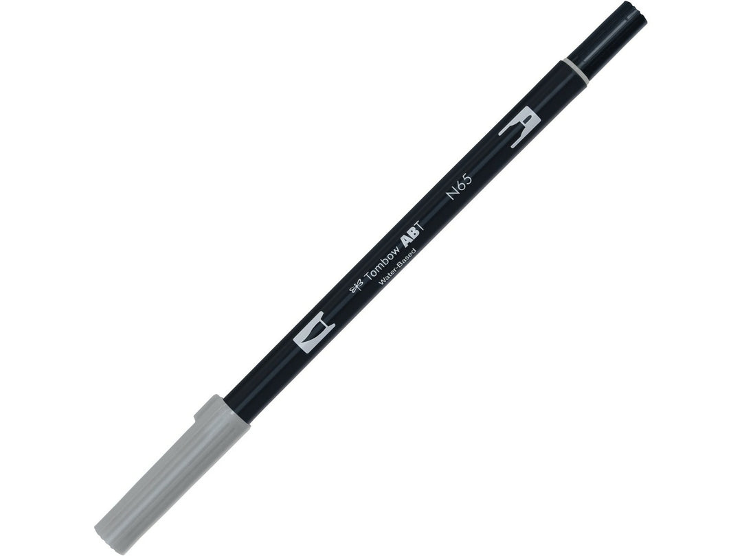 Tombow ABT Dual Brush Pen in Cool Grey 5 (N65) with dual-tip design, featuring a flexible brush tip and fine bullet tip for sketching, shading, hand lettering, illustration and monochrome artwork.
