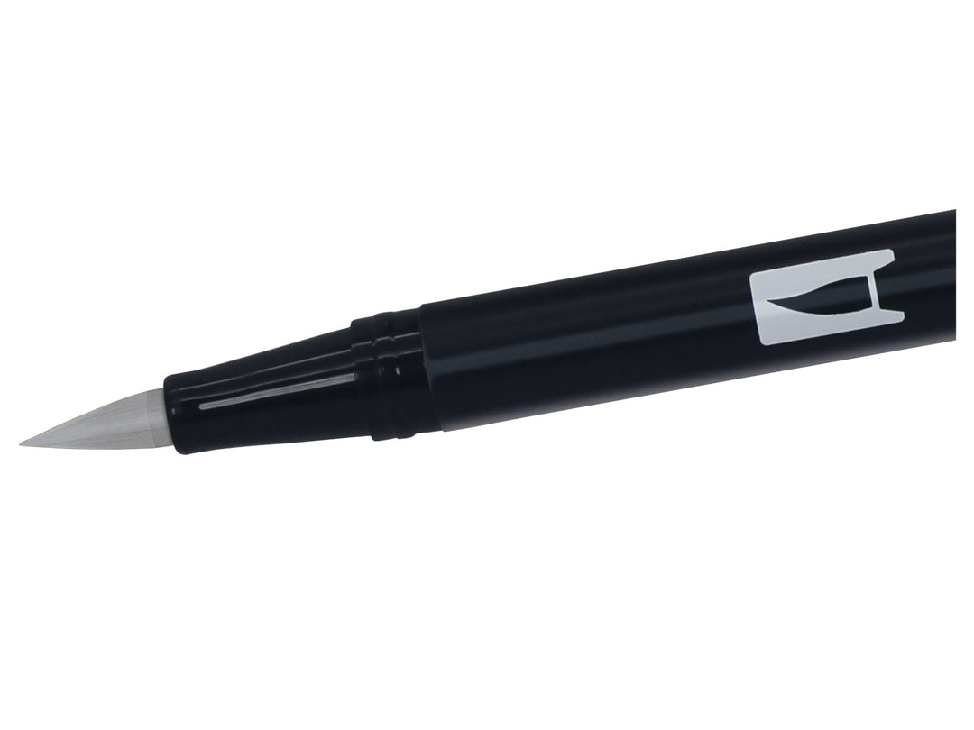 Close-up of the flexible brush tip on a Tombow ABT Dual Brush Pen in Cool Grey 5 (N65), designed for creating variable line widths, sketching, shading, hand lettering, illustration and monochrome artwork.
