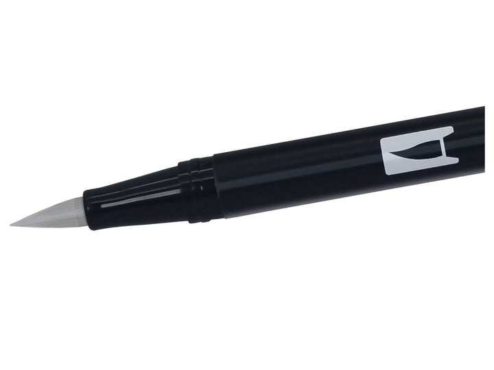 Close-up of the flexible brush tip on a Tombow ABT Dual Brush Pen in Cool Grey 5 (N65), designed for creating variable line widths, sketching, shading, hand lettering, illustration and monochrome artwork.