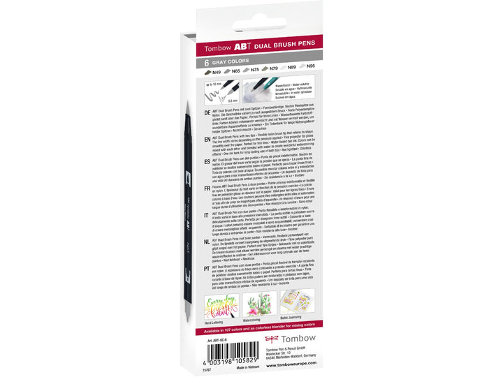 Rear of Tombow ABT Dual Brush Pen Grey Colours Set of 6 packaging showing the included warm and cool grey colour assortment, dual-tip illustrations, product information, creative artwork examples and barcode details.