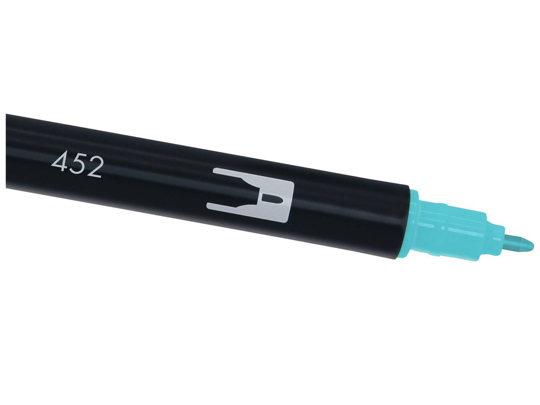 Close-up of the fine bullet tip on a Tombow ABT Dual Brush Pen in Process Blue (452), designed for precise lines, outlines, lettering details, journaling, illustration and creative artwork.