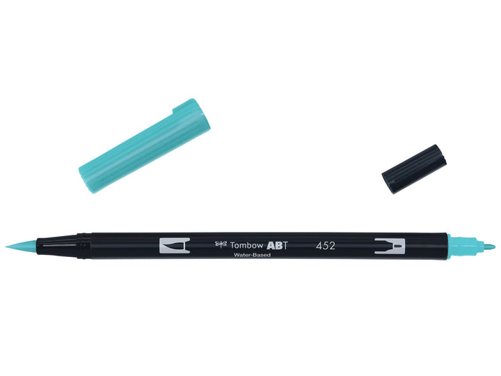 Tombow ABT Dual Brush Pen in Process Blue (452) displayed with both caps removed, showing the flexible brush tip and fine bullet tip for hand lettering, illustration, colouring, journaling and watercolour-style effects.