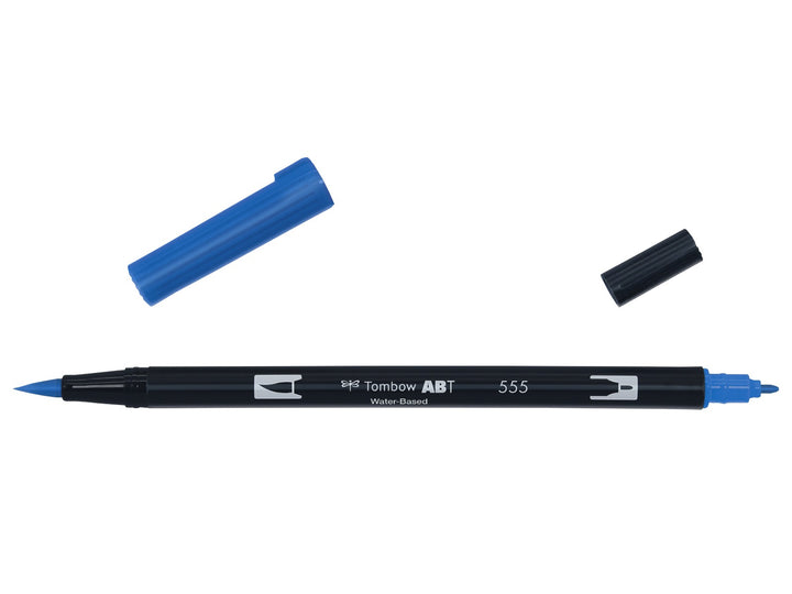 Tombow ABT Dual Brush Pen in Ultramarine (555) displayed with both caps removed, showing the flexible brush tip and fine bullet tip for hand lettering, illustration, colouring and watercolour-style effects.