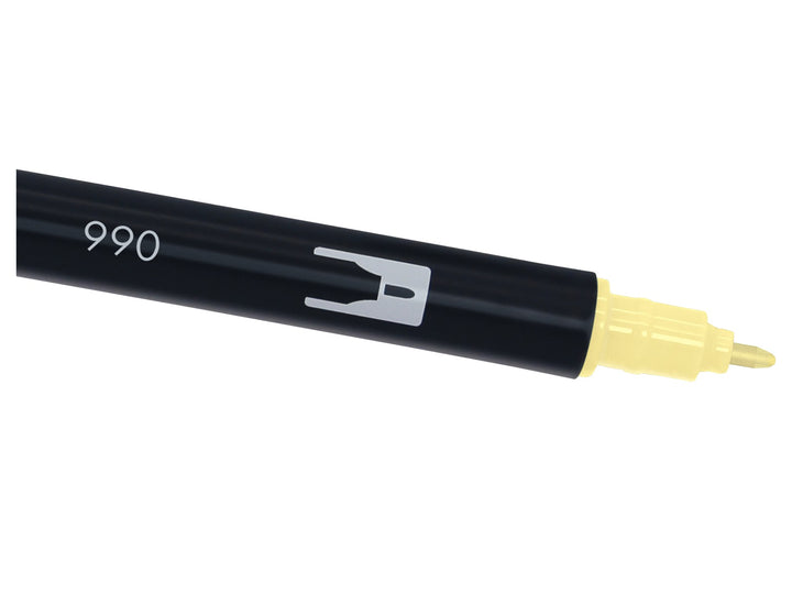 Close-up of the fine bullet tip on a Tombow ABT Dual Brush Pen in Light Sand (990), designed for precise lines, lettering details, outlines, graphics and portrait illustration work.