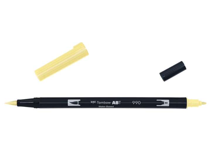 Tombow ABT Dual Brush Pen in Light Sand (990) displayed with both caps removed, showing the flexible brush tip and fine bullet tip for portrait illustration, colouring, hand lettering and watercolour-style effects.