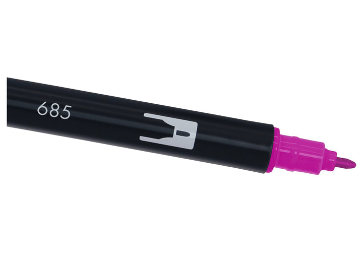 Close-up of the fine bullet tip on a Tombow ABT Dual Brush Pen in Deep Magenta (685), designed for precise lines, outlines, lettering details, graphics and illustration work.