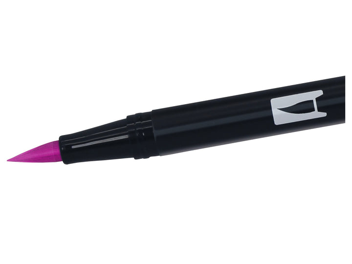 Close-up of the flexible brush tip on a Tombow ABT Dual Brush Pen in Deep Magenta (685), designed for creating variable line widths, hand lettering, illustration, colouring and watercolour-style effects.