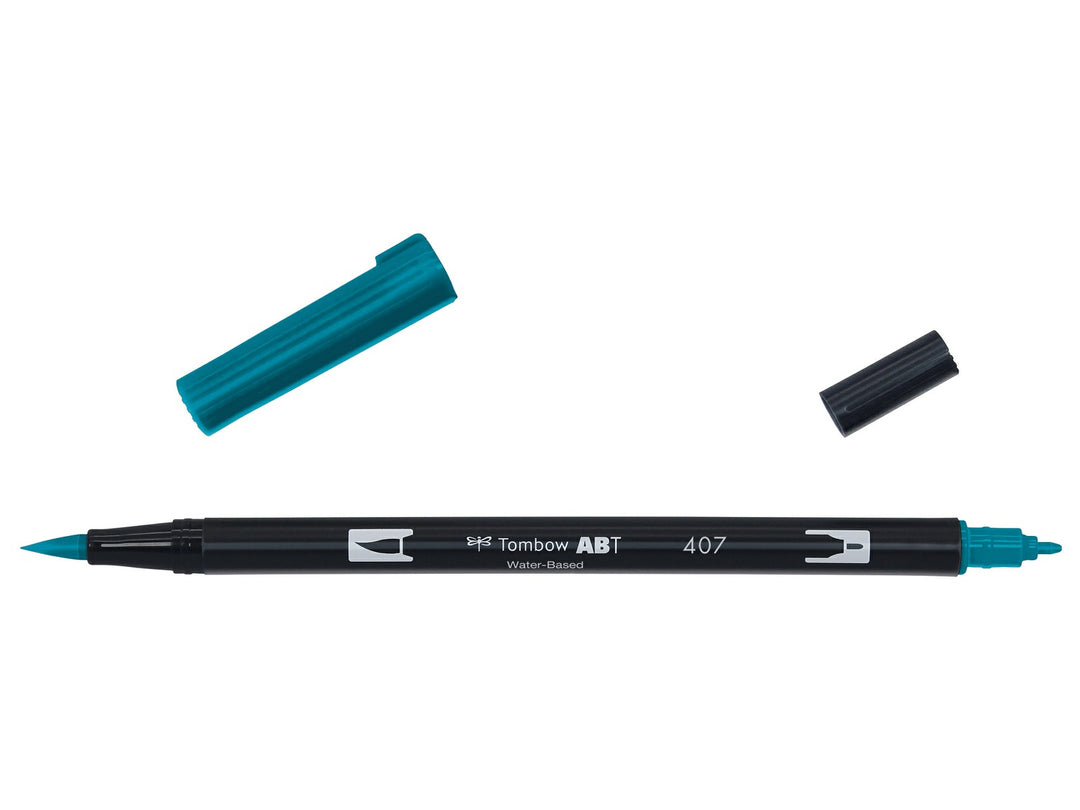 Tombow ABT Dual Brush Pen in Tiki Teal (407) displayed with both caps removed, showing the flexible brush tip and fine bullet tip for hand lettering, illustration, journaling, colouring and watercolour-style effects.