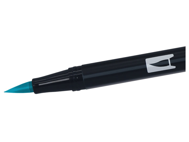 Close-up of the flexible brush tip on a Tombow ABT Dual Brush Pen in Tiki Teal (407), designed for creating variable line widths, hand lettering, illustration, journaling, colouring and watercolour-style effects.