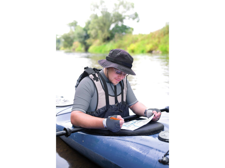 Tombow AirPress ballpoint pen being used during outdoor navigation from a kayak, demonstrating reliable writing performance in wet and challenging conditions