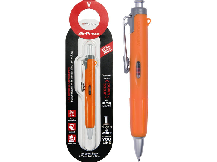Tombow AirPress orange ballpoint pen displayed alongside original retail blister packaging, featuring pressurised ink technology, refillable design and metal pocket clip