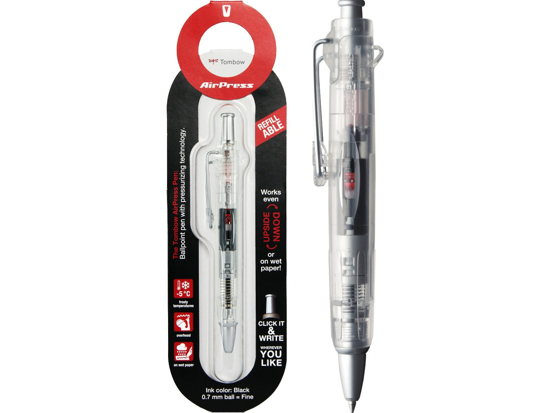 Tombow AirPress transparent ballpoint pen displayed alongside original retail blister packaging, featuring pressurised ink technology, visible internal mechanism and refillable design