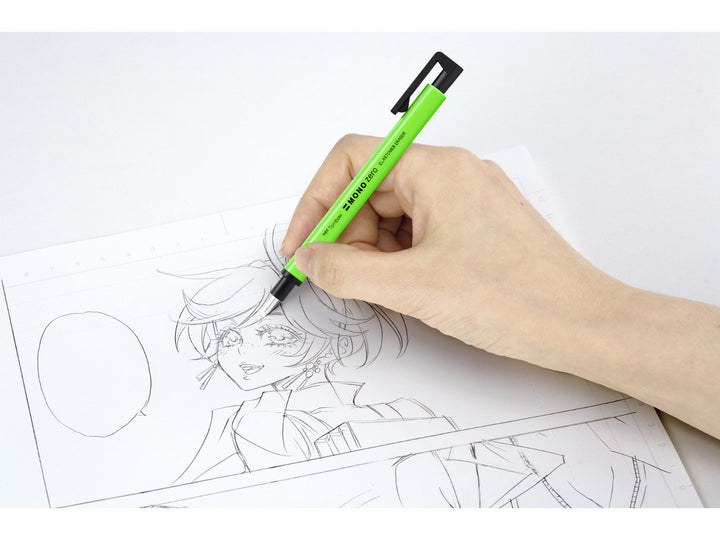 Tombow MONO Zero precision eraser being used for manga and illustration artwork, demonstrating accurate detail correction with the 2.3mm round eraser tip and pen-style design
