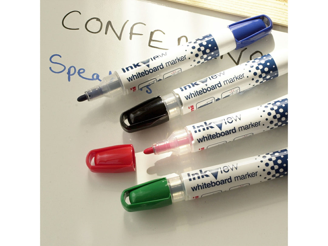 uni-ball Inkview whiteboard markers in assorted colours displayed on a whiteboard surface, showing visible ink windows, bullet tips and dry-wipe writing performance