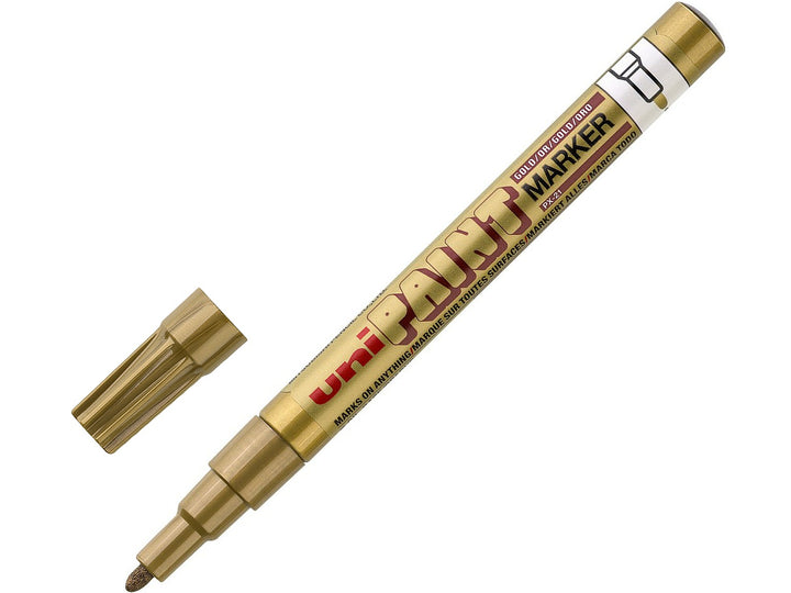 Gold uni-ball PX-21 fine paint marker shown uncapped with cap removed, featuring a 1.2mm acrylic bullet nib and opaque metallic gold oil-based paint ink for precise marking, decoration, labelling and creative projects