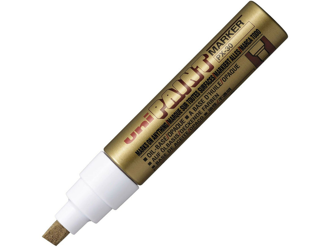 Gold uni PX-30 broad paint marker shown uncapped, featuring an 8mm chisel tip and metallic gold barrel