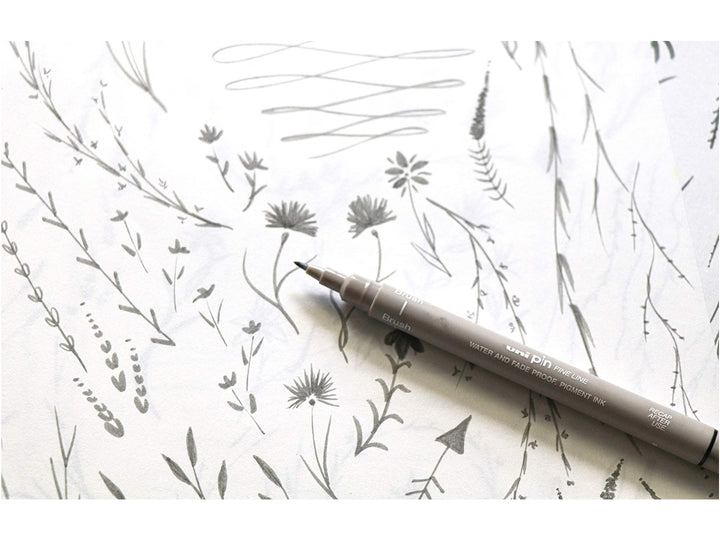 uni PIN Light Grey fineliner drawing pen creating delicate botanical illustrations, showcasing light grey archival-quality pigment ink for sketching, illustration and detailed creative artwork