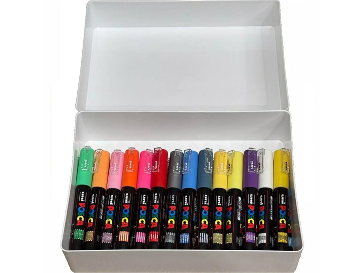 Open white storage box containing assorted uni POSCA PC-1M Extra Fine Paint Markers arranged by colour, featuring ultra-fine 0.7mm tips and water-based pigment paint in vibrant shades including green, orange, pink, red, blue, yellow, violet and white for illustration, hand lettering, outlining, card making, model detailing and creative projects on multiple surfaces.