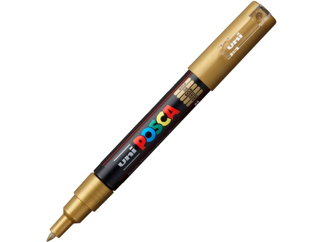 Gold uni POSCA PC-1M extra fine water-based paint marker shown diagonally with cap attached, featuring a metallic gold pigment ink and precision 0.7mm bullet tip