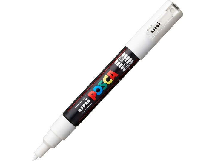 White uni POSCA PC-1M extra fine water-based paint marker shown diagonally with cap attached, featuring a precision 0.7mm bullet tip for detailing, lettering and creative artwork