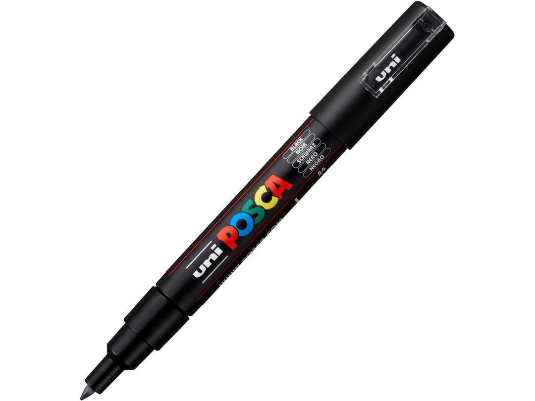 Black uni POSCA PC-1MR extra fine water-based paint marker shown at an angle with cap attached, featuring an ultra-fine calibrated tip for detailed artwork and precision marking