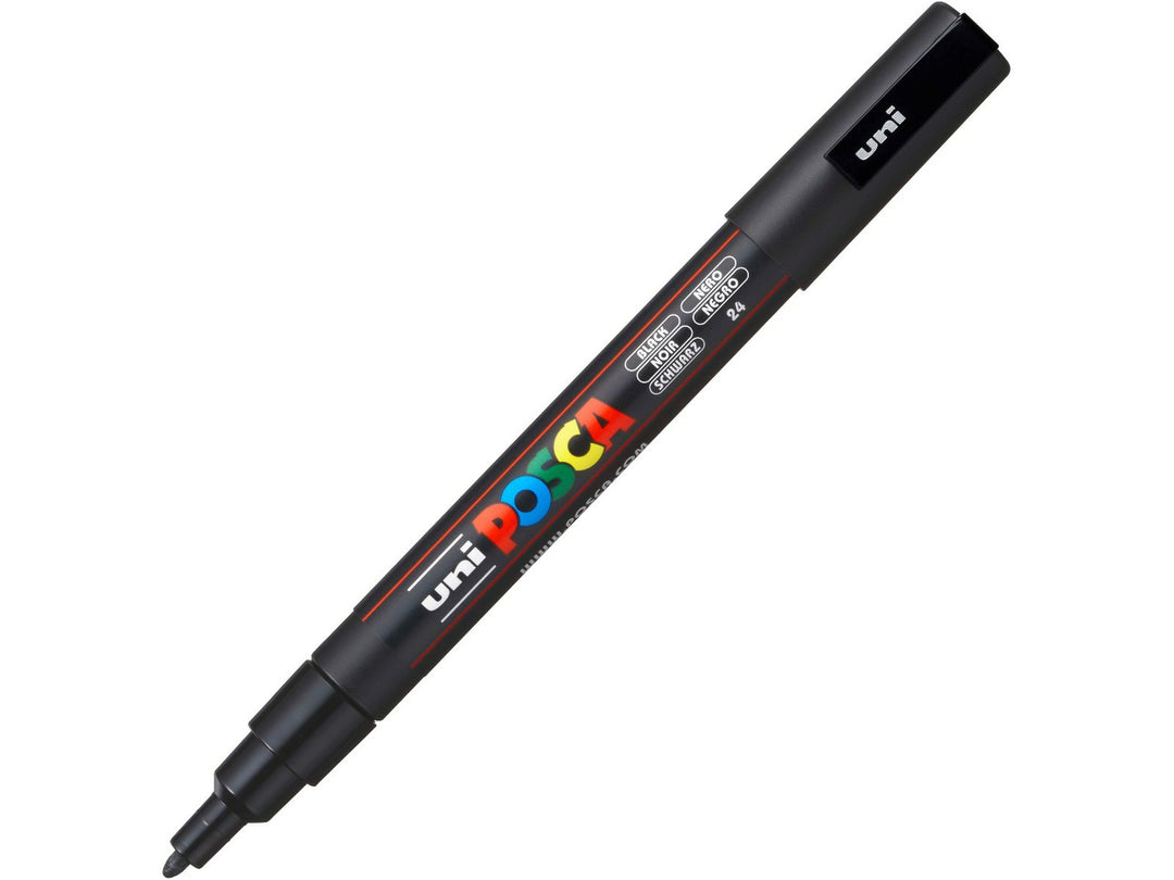 Black uni POSCA PC-3M fine water-based paint marker shown diagonally with cap removed, featuring a 0.9–1.3mm bullet tip for outlining, lettering, illustration and creative projects