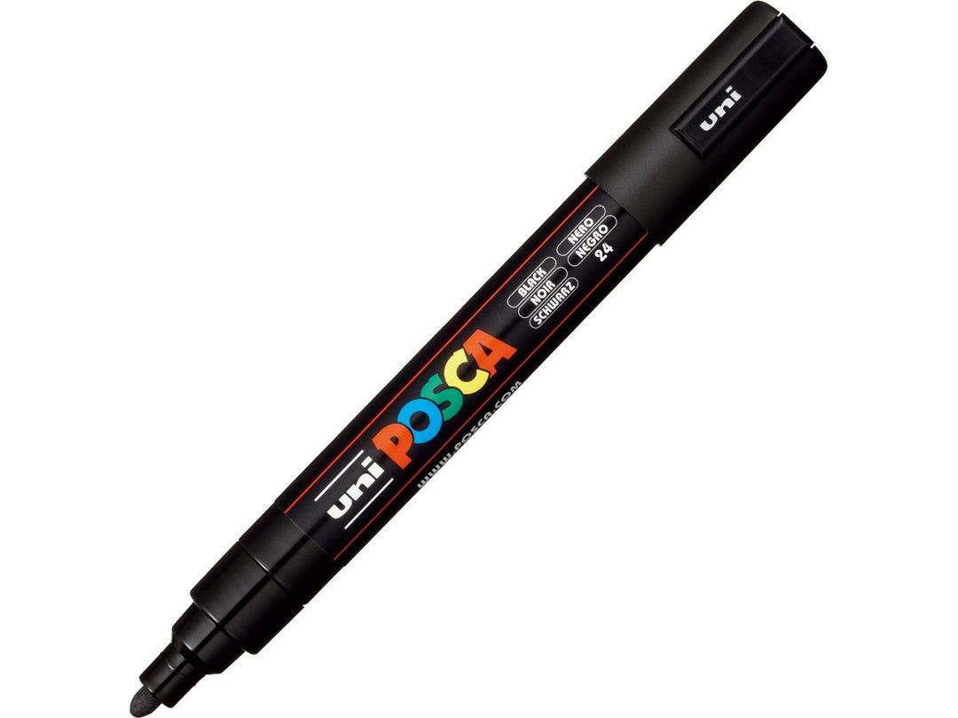 Black uni POSCA PC-5M medium water-based paint marker shown diagonally with cap attached, featuring a 1.8–2.5mm bullet tip for lettering, illustration, signage and creative projects