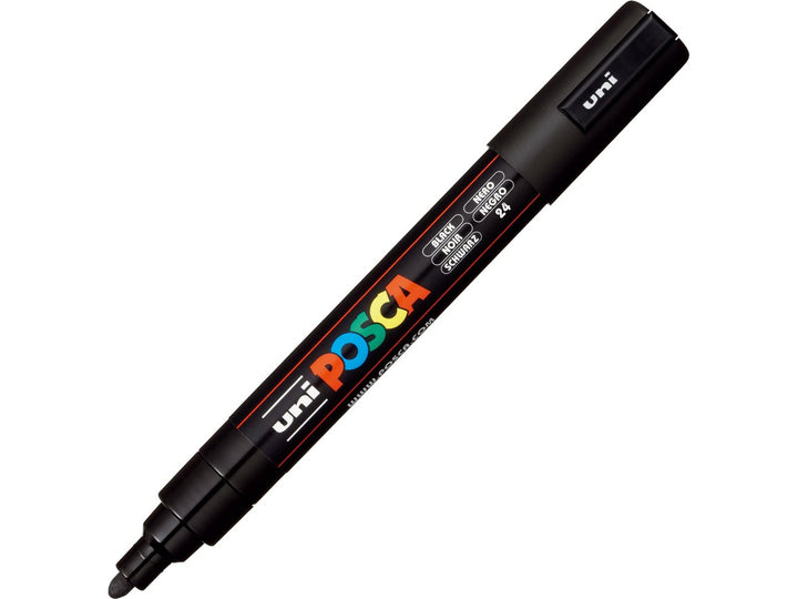 Black uni POSCA PC-5M medium water-based paint marker shown diagonally with cap attached, featuring a 1.8–2.5mm bullet tip for lettering, illustration, signage and creative projects
