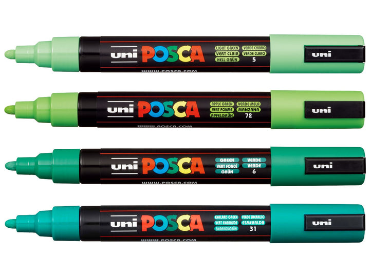Four uni POSCA PC-5M Green paint markers shown uncapped in Light Green, Apple Green, Green and Emerald Green, arranged from light to dark