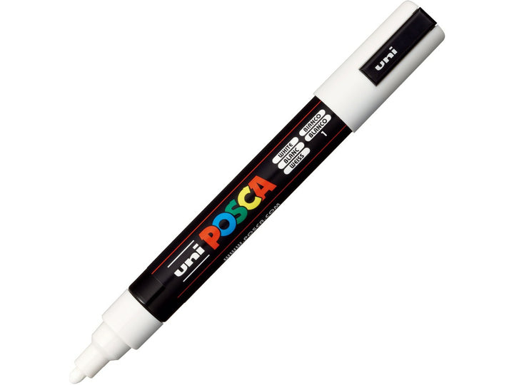 White uni POSCA PC-5M medium water-based paint marker shown diagonally with cap removed, featuring a 1.8–2.5mm bullet tip for lettering, illustration, signage and creative projects