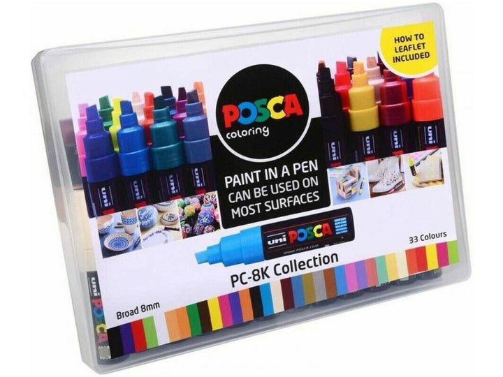 uni POSCA PC-8K collection box containing 33 assorted broad 8mm chisel tip paint markers, shown in a clear presentation case with colour guide and instruction leaflet